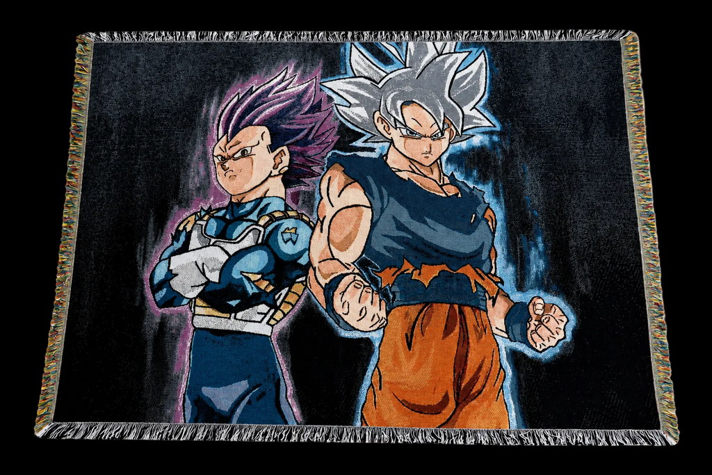 A rectangular woven throw blanket with fringe on all sides, featuring anime characters Vegeta and Goku from Dragon Ball Z on a dark background.